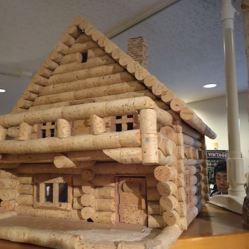 Log cabin made of wine corks